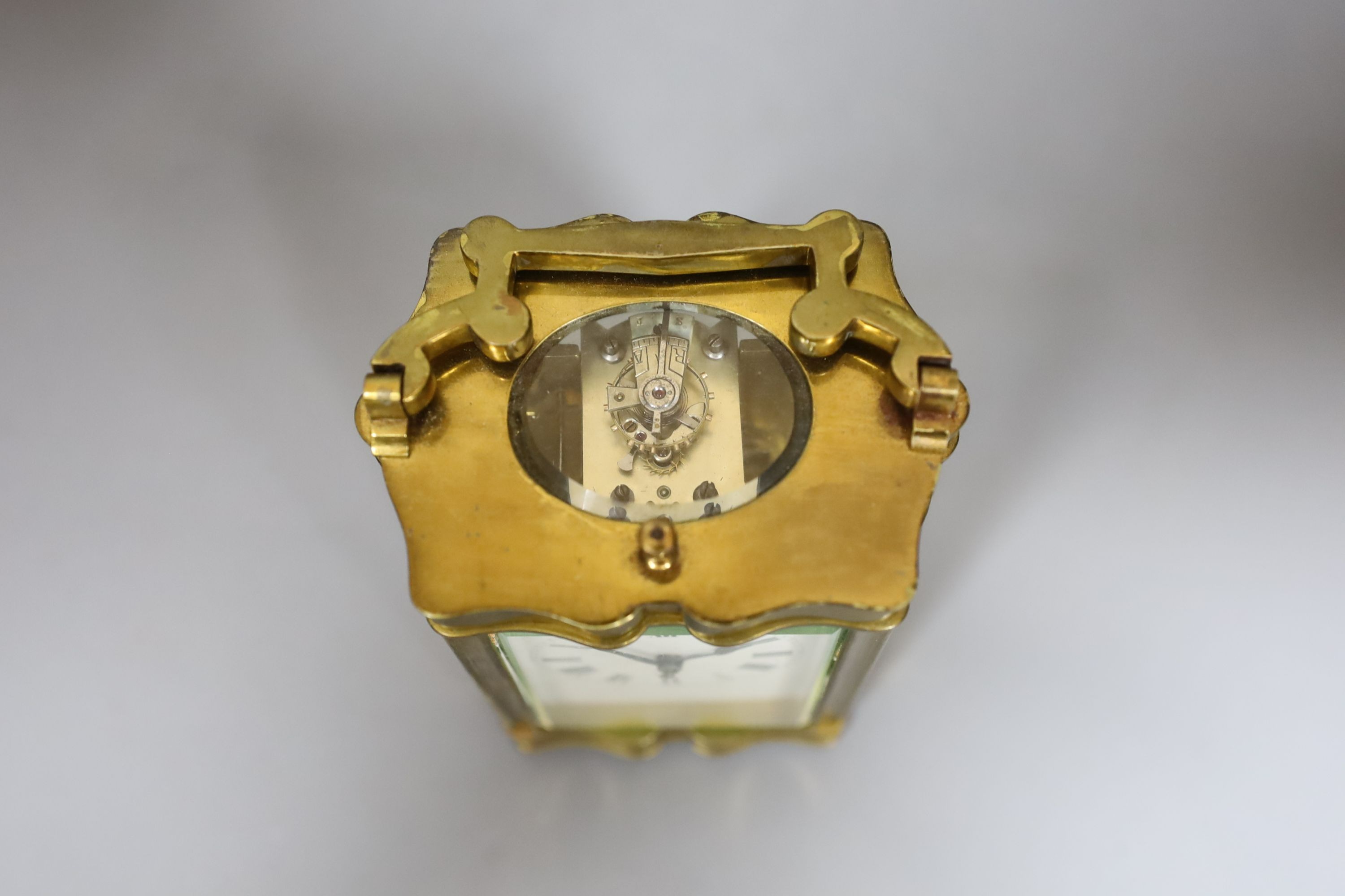 A cased brass repeating carriage clock, in case, 12 cms high.